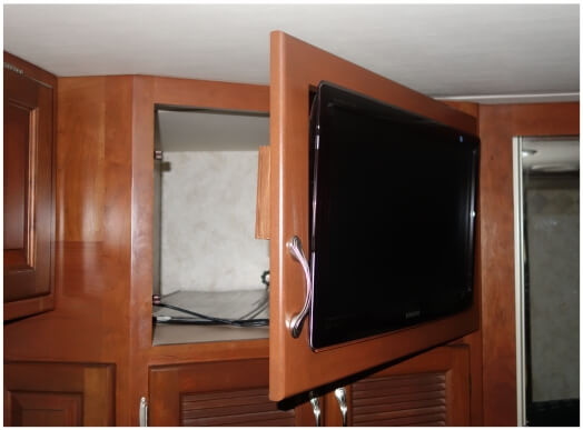 tv-mounted-swinging-door Bedroom TV mounted with swinging door